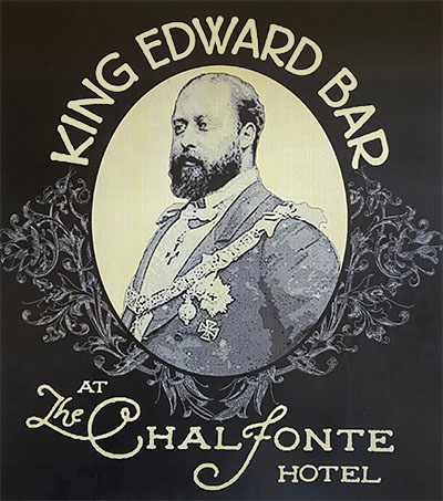 A distinguished looking person in a suit at 3/4 profile. Text: King Edward Bard at the Chalfonte Hotel